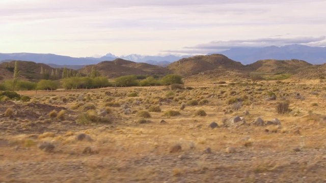 POV, Point of View &ndash; looking through car window. Dolly over Mountain, country side, driving on road.