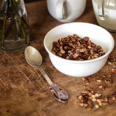 Breakfast granola with milk, cookies. Tasty and healthy food