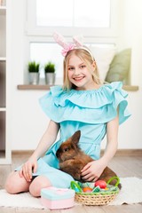 Teenage girl holding Easter eggs