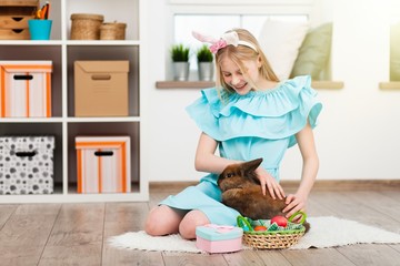 Teenage girl holding Easter eggs
