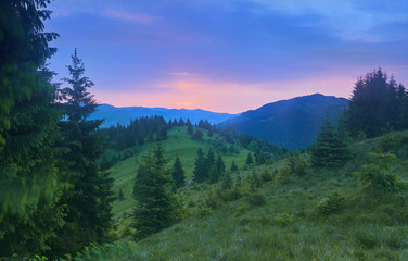 Colorful summer sunset in mountains