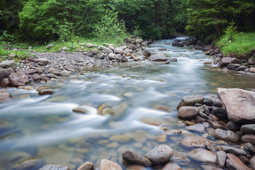 River deep in mountain forest.