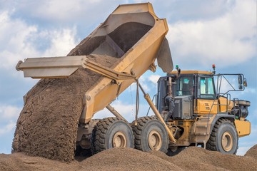 Construction Site - Engineering - Sea Defence. Large plant machinery being use to build the beach sea defence at Seaford, East Sussex, UK