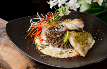 Grilled sea bass fillet with ginger, almonds, lime sauce with Japanese soba noodles