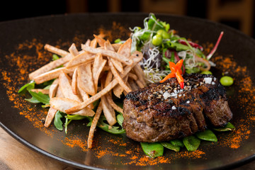Lemongrass grilled beef steak with snow peas and taro potatoes