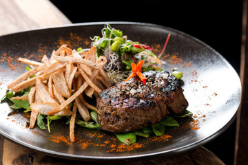 Lemongrass grilled beef steak with snow peas and taro potatoes
