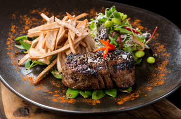 Lemongrass grilled beef steak with snow peas and taro potatoes