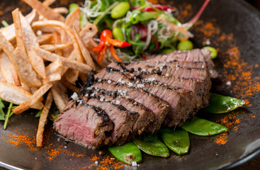 Lemongrass grilled beef steak with snow peas and taro potatoes