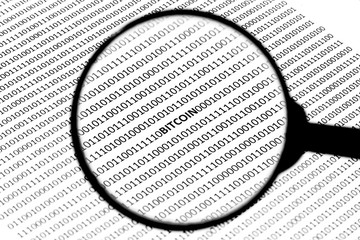 A cryptocurrency concept image consisting of a magnifying glass, digital code and the word, "BITCOIN".