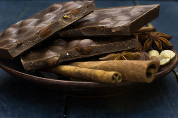 Texture of milk chocolate. Cinnamon, nuts and spices.
