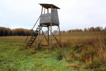 Biotechnical structure intended for hunting and watching wild animals, against the backdrop of autumn nature.