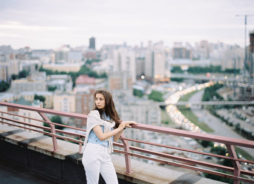 Woman posing on background of city