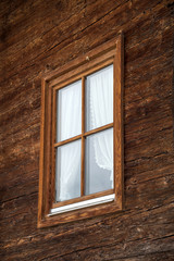 Window on a wooden wall