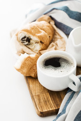 Morning coffee with croissant on the table