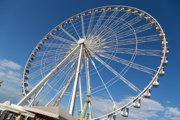 Ferris wheel Roue de Paris at Place de la Concorde. Sunny day. Travel to famous landmarks