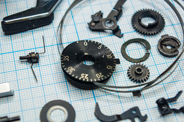 parts old retro film SLR camera on graph paper