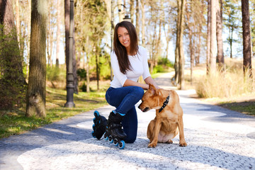 Outdoors lifestyle portrait of a beautiful girl wearing roller s