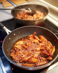 Wok pan with chicken wings
