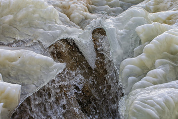 Magic isc sculptures at the beach , on a frosty winter day. - Frozen Ocean ice formations at the Baltic Sea