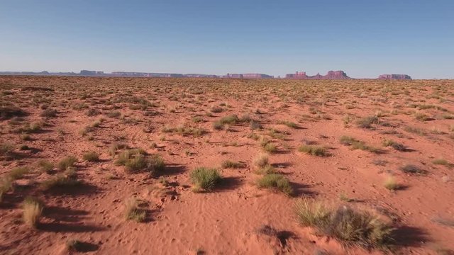 fly up to low Wild horses, drone aerial 4k, monument valley, valley of the gods, desert, cowboy, desolate, mustang, range, utah, nevada, arizona, gallup, paint horse