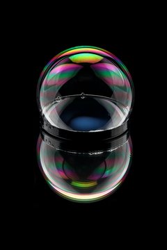 Bubble on mirror with Rainbow colors and reflections