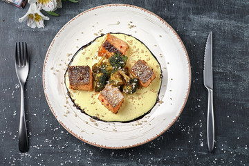 Baked fish Salmon in saffron sauce with broccoli. Dietary menu. Fish menu. Seafood - salmon.