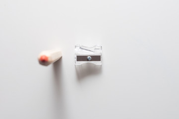 Pencil and sharpener  isolated on a white background.  Red pencil and sharpener