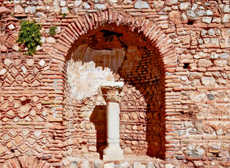 ruins of ionic column and arch delphi greece