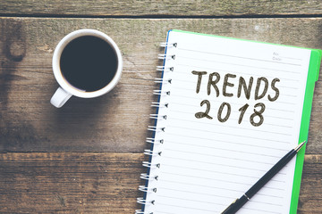 trends 2018 text on notepad on office desk