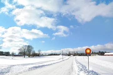 Fotobehang Snowy road in Sweden during a sunny day © glimpseofsweden