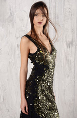 Naklejka premium beautiful young woman in fashion outfit