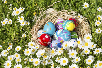 Colorful easter eggs on grass