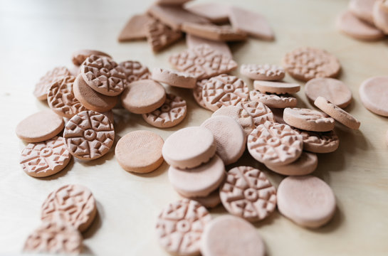 detail of tile ceramics pieces piled up on desk