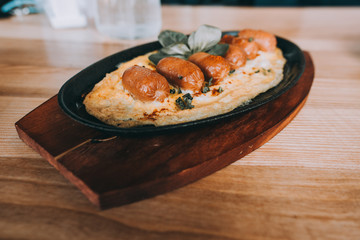 Omelette with chorizo sausage, herbs and tomatoes