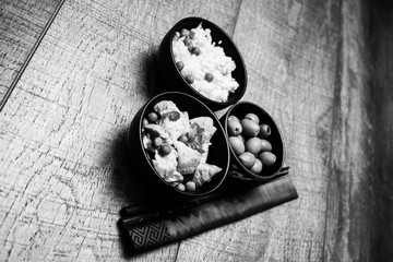 Chinese rice bowl on wood or wooden background with chopsticks