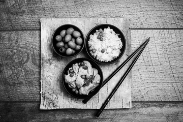 Chinese rice bowl on wood or wooden background with chopsticks