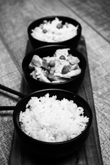 Chinese rice bowl on wood or wooden background with chopsticks
