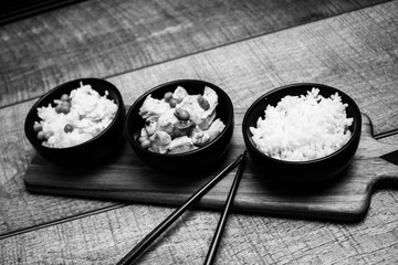 Chinese rice bowl on wood or wooden background with chopsticks