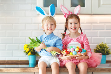 Happy easter! funny funny children  l with ears hare getting ready for  holiday