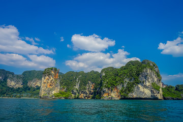 Fototapeta na wymiar Outdoor view of many beautiful islands near Railay beach with blue sky in Krabi province in the Andaman sea in south Thailand