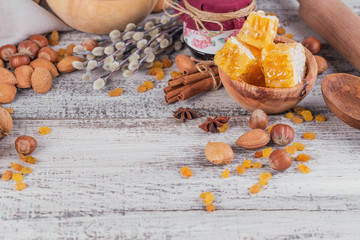 Ingredients for cooking bread or cookies: honeycomb, flour, raisines, mix of nuts, spices