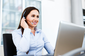 Beautiful young woman working at call center