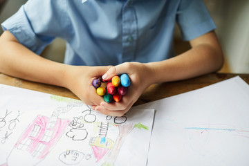 Child holding crayons
