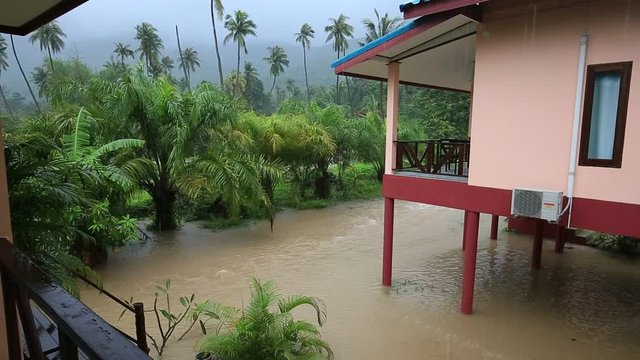 Flooding and tropical rain on the street in island Koh Phangan, Thailand