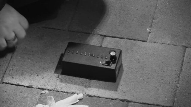 A steady medium shot of a ghost haunting device.