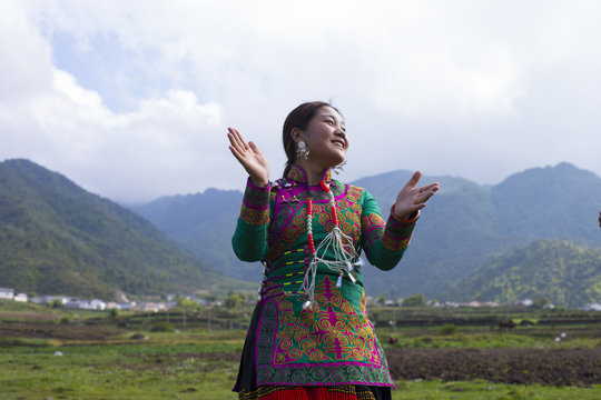 Beautiful Chinese Yi people in traditional costumes  outdoor