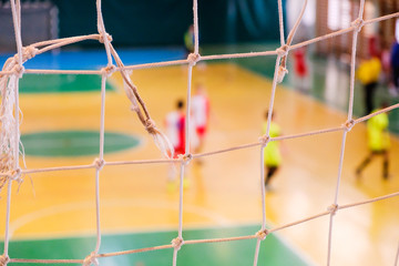 Football defocused player penalty on field, Futsal ball field in the gym indoor, Soccer sport field