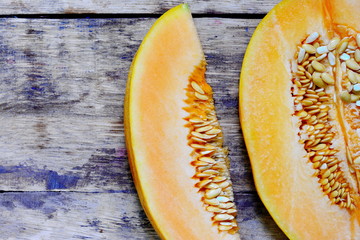 melon slices on the rustic wooden board.