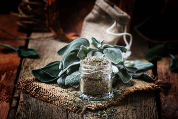 Dried and fresh sage, rustic style, vintage wooden background, selective focus