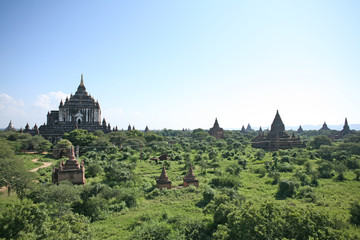 Multiple pieces of ancient architecture dot the landscape of the Bagan plains in Burma